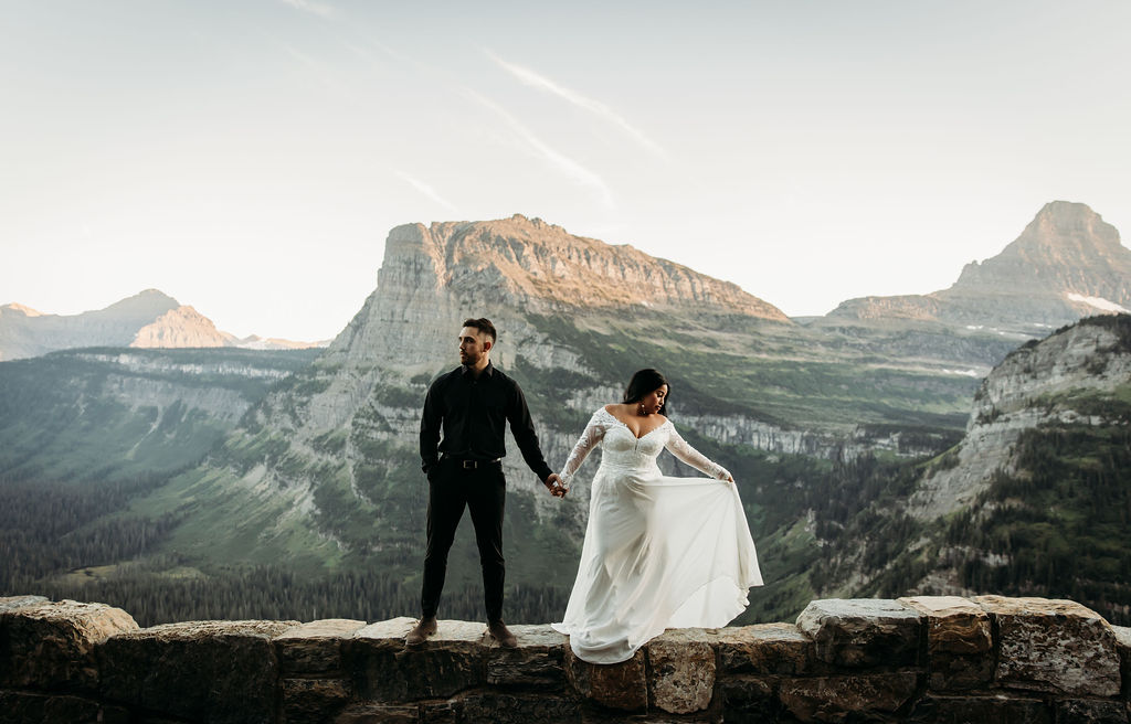 couple posing for photos during glacier national park elopement 