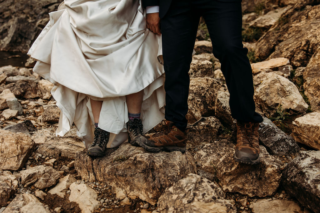 bride and groom wearing hiking boots for adventurous elopement