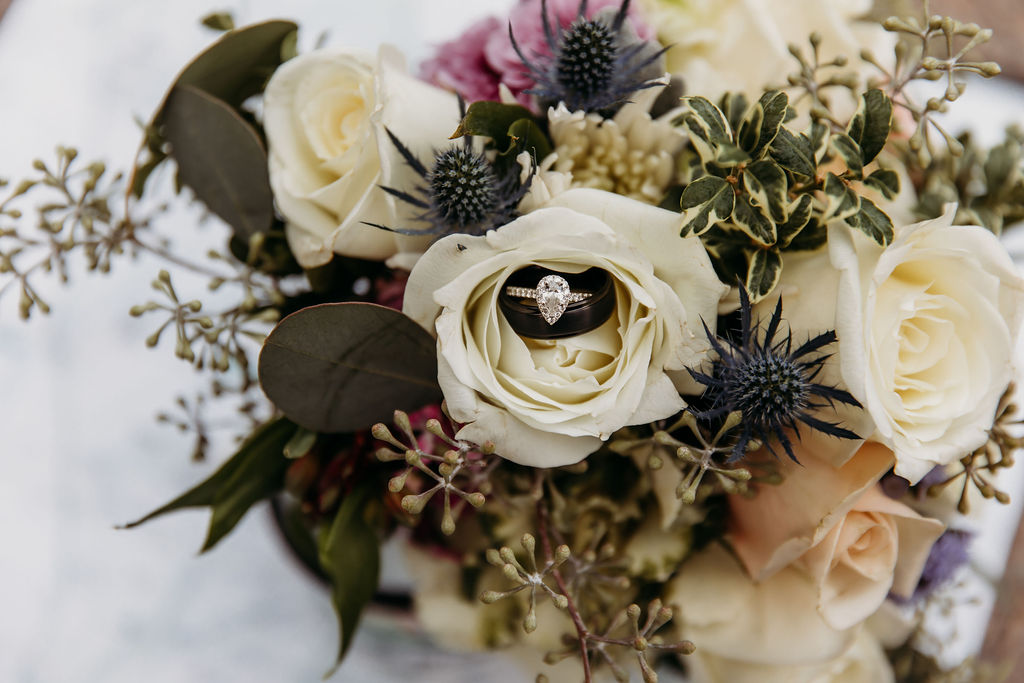 wedding detail photo with ring in wedding bouquet