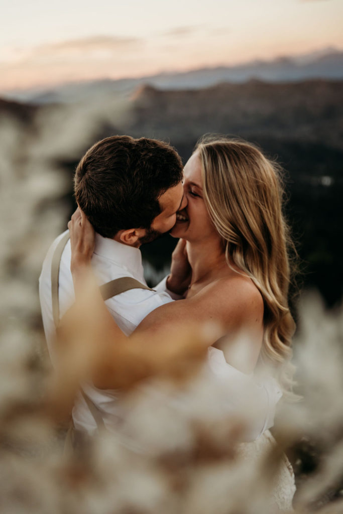 Couple posing in the mountains during elopement photoshoot