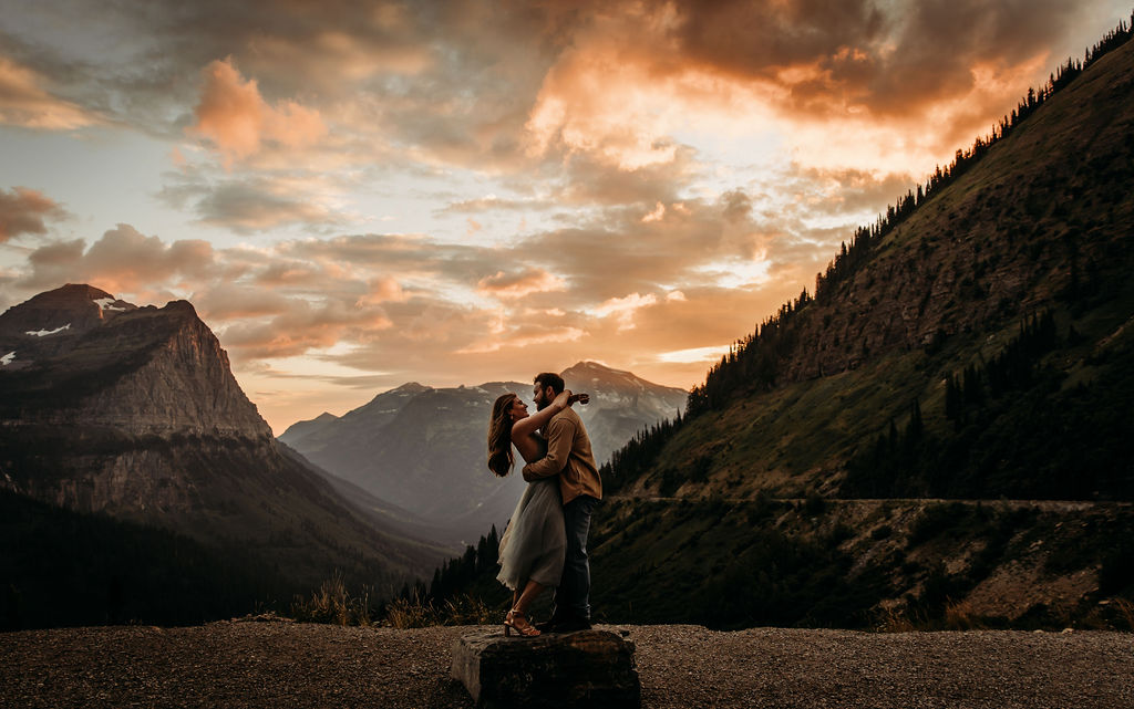 Couples adventurous mountain engagement photos in Glacier National Park
