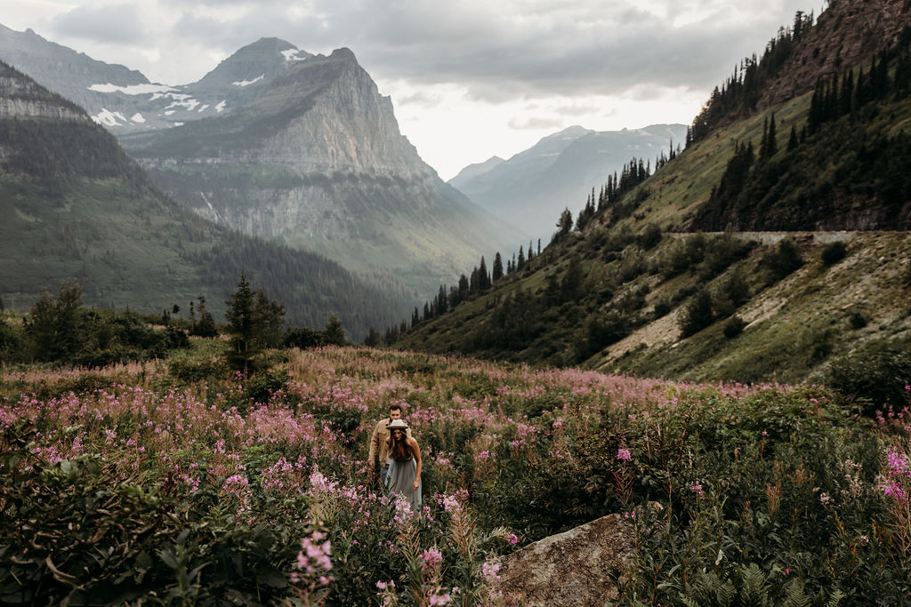 Couple posing for photos in Big Bend in Glacier National Park