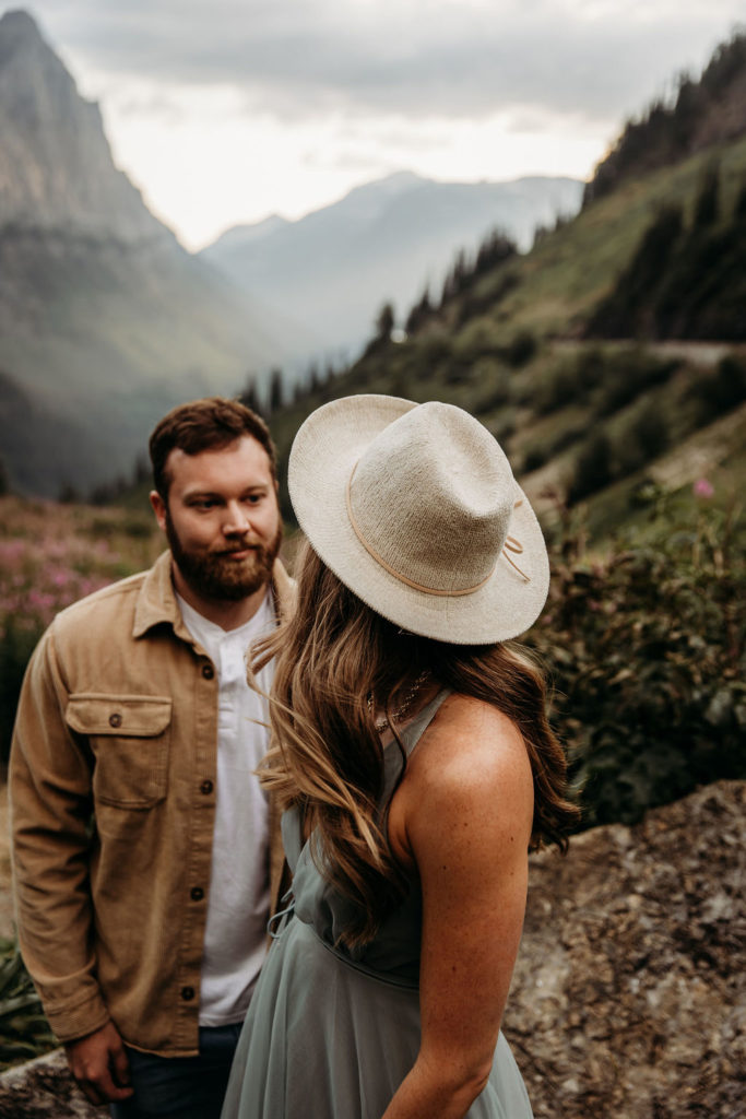 Couple posing for photos in Big Bend in Glacier National Park
