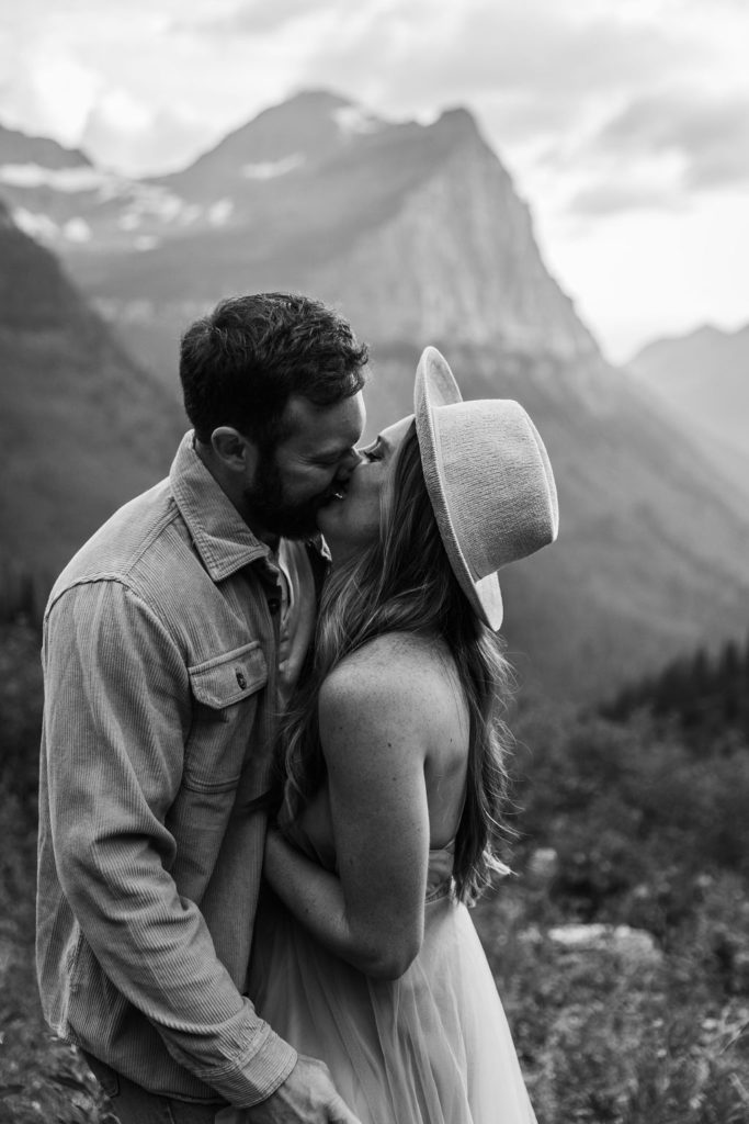 Couple posing for adventurous photos in Glacier National Park