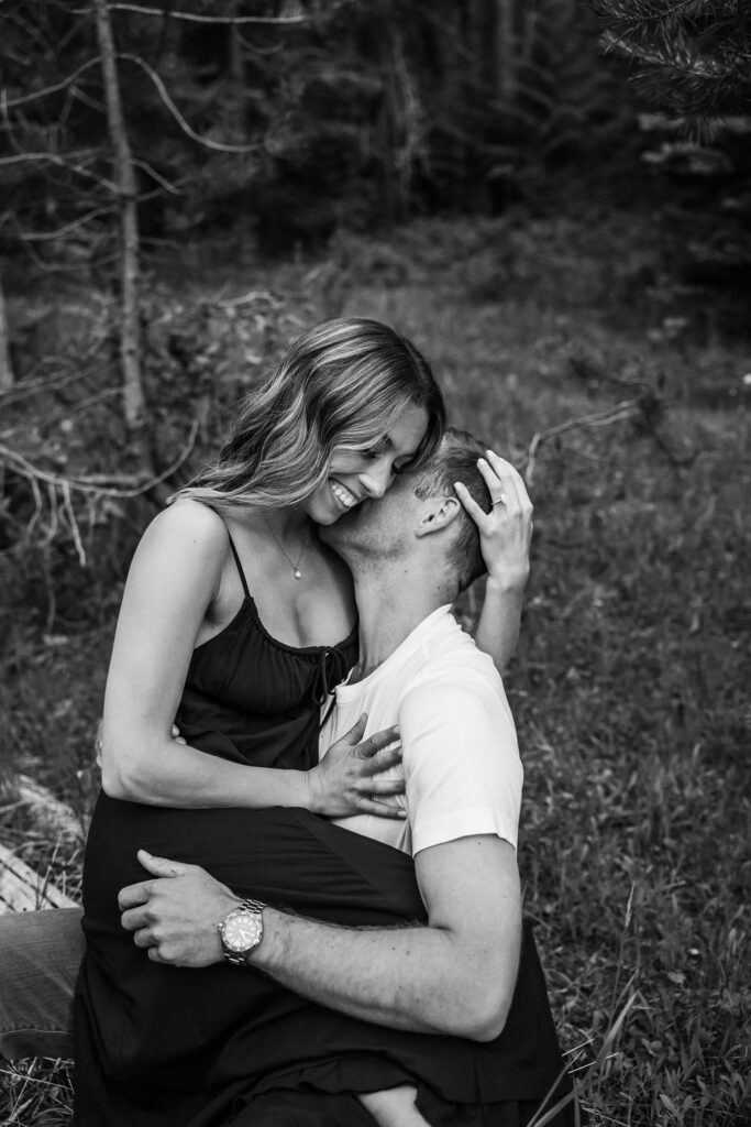 Couple posing for Glacier National Park engagement photos captured by Photography by Brogan - Montana Photographer