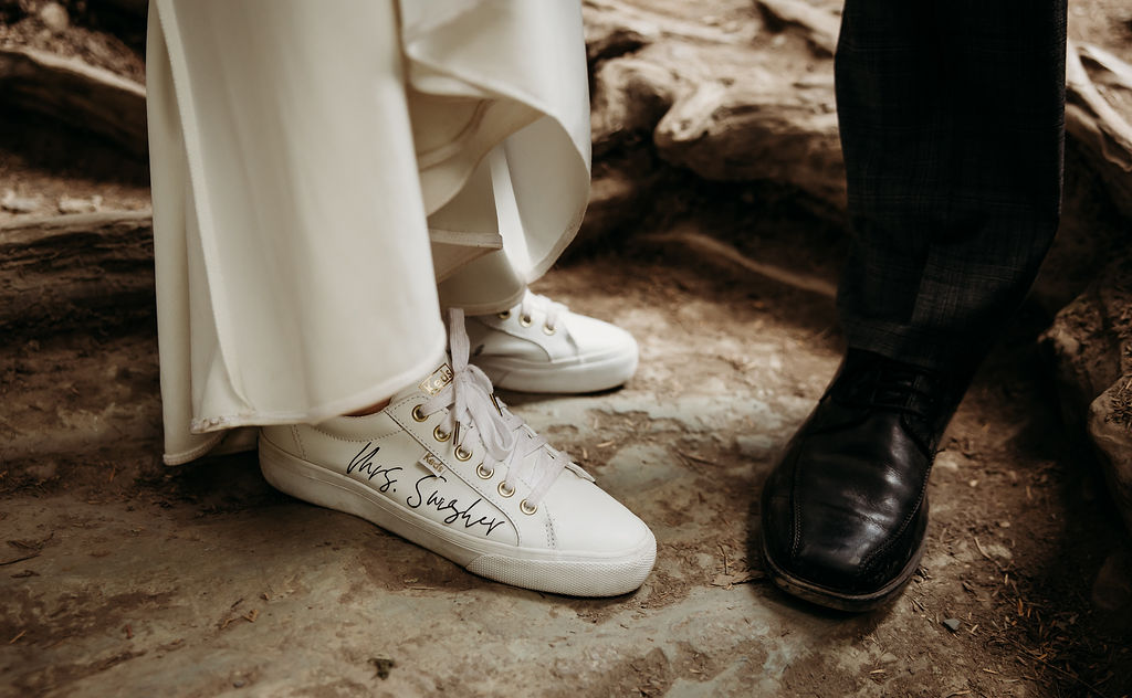 Bride and grooms hiking shoes from wedding day