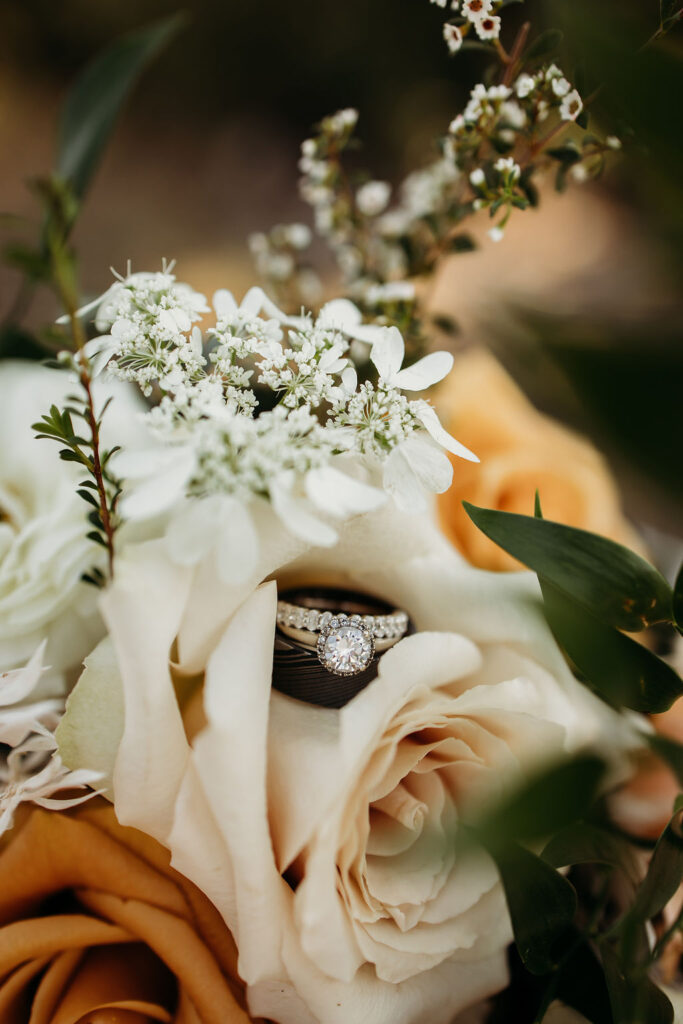 Elopement Photography Inspiration in The Mountains of Glacier National Park | Wedding bouquet with rings