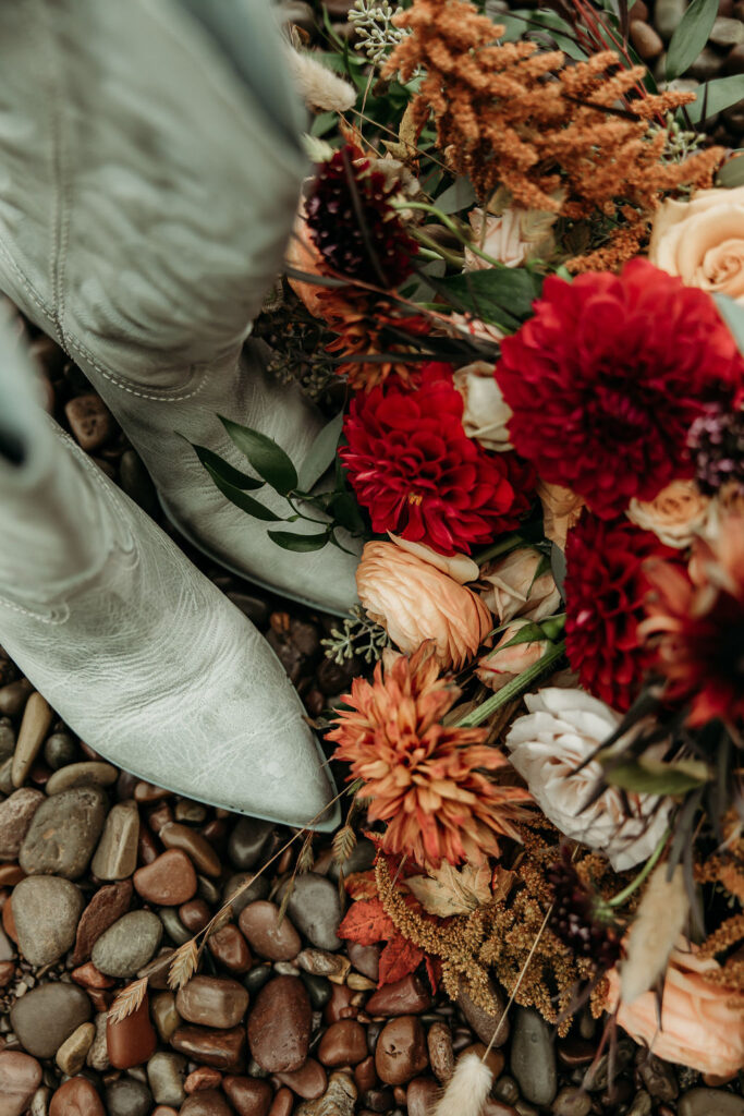 Elopement Photography Inspiration in The Mountains of Glacier National Park | Wedding florals and boots