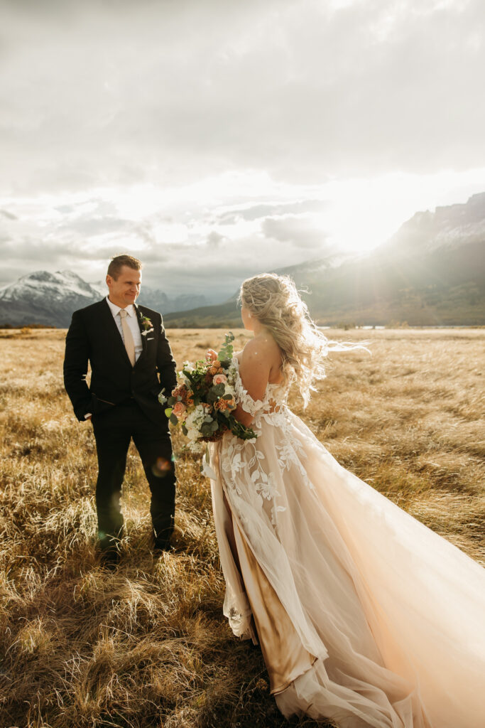 Elopement Photography Inspiration in The Mountains of Glacier National Park | Bride and groom fall wedding portraits