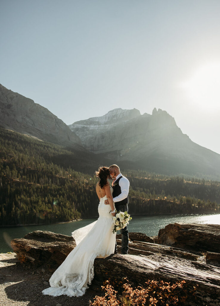 Bride and grooms sunrise elopement photos in Glacier National Park
