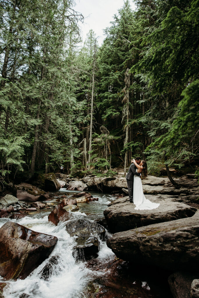 Bride and groom portraits at Avalanche Lake in GNP