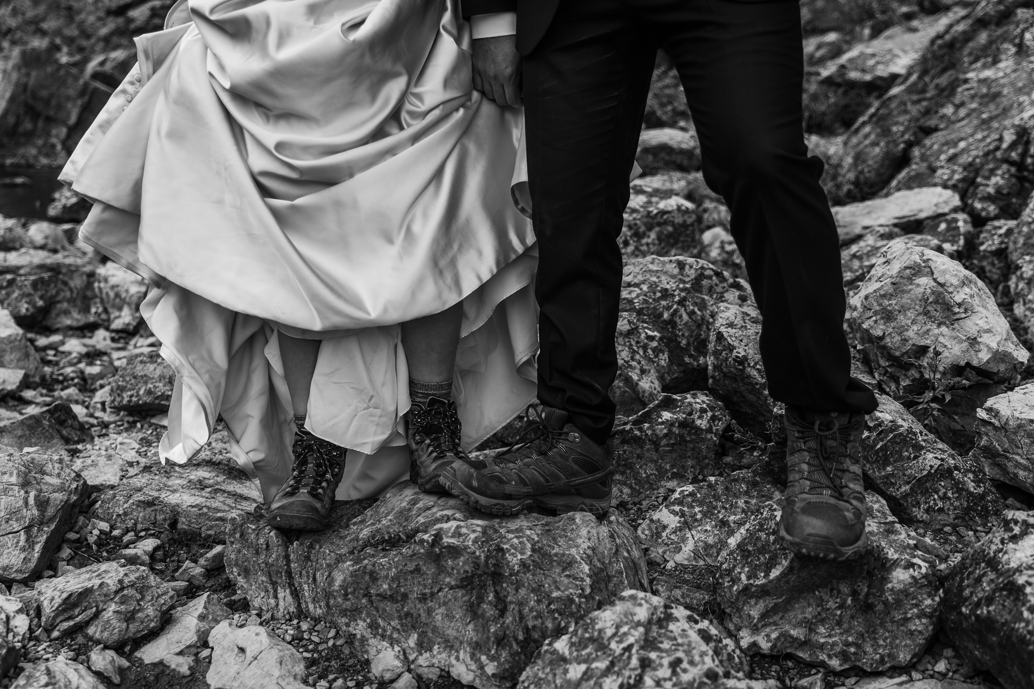 Bride and groom wearing hiking boots in GNP