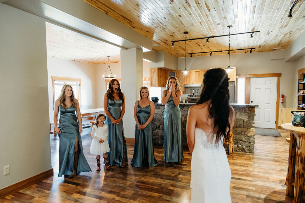 Brides first look with bridesmaids