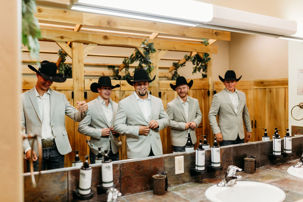 Groom and groomsmen photos from a fall western wedding in Montana at Star Meadows Ranch