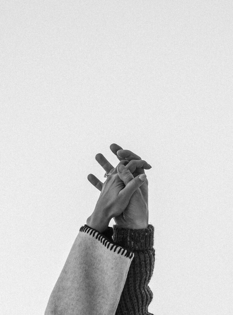 Black and white photo of couples hand
