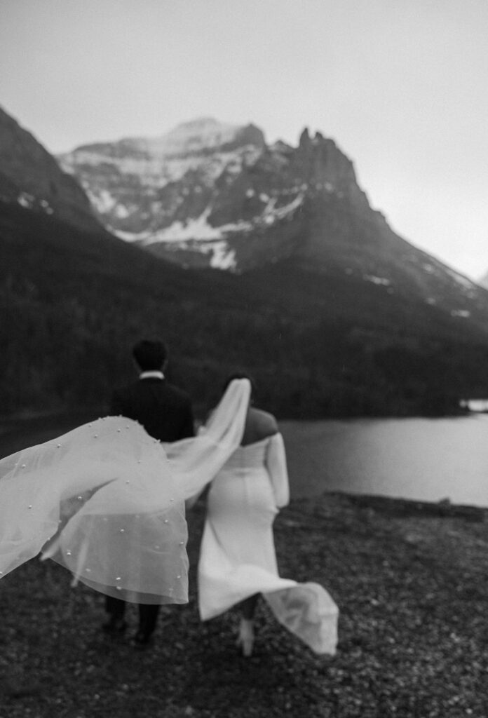 a couple posing in glacier national park for their elopement
