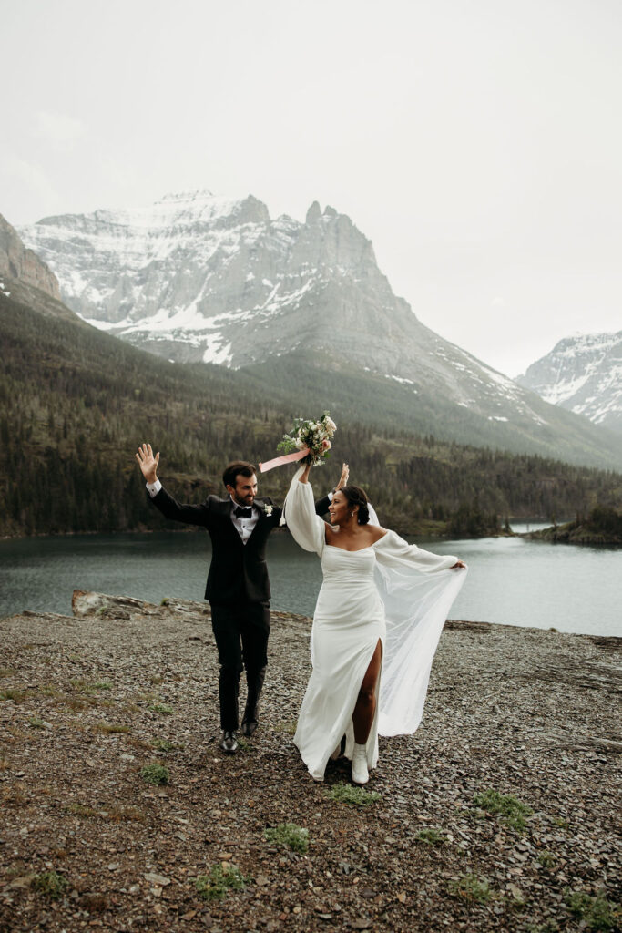 a couple posing in glacier national park for their elopement
