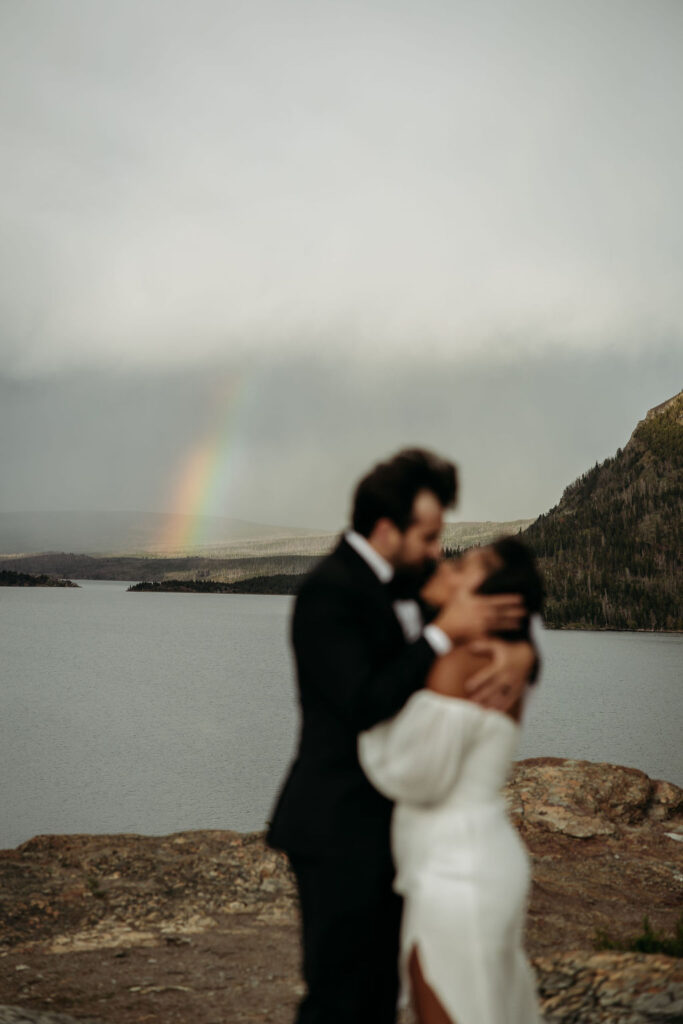 a couple posing in glacier national park for their elopement
