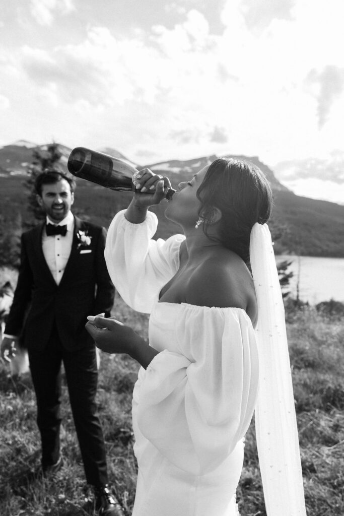 a couple posing in glacier national park for their elopement
