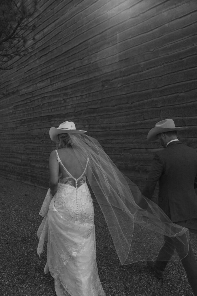 bride and groom posing for wedding portraits
