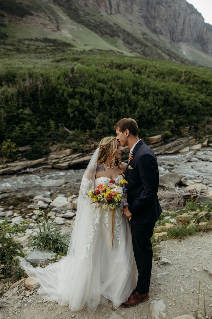 bride and groom taking elopement photos
