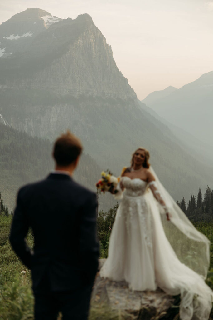 couple having an elopement in gnp at going to the sun road