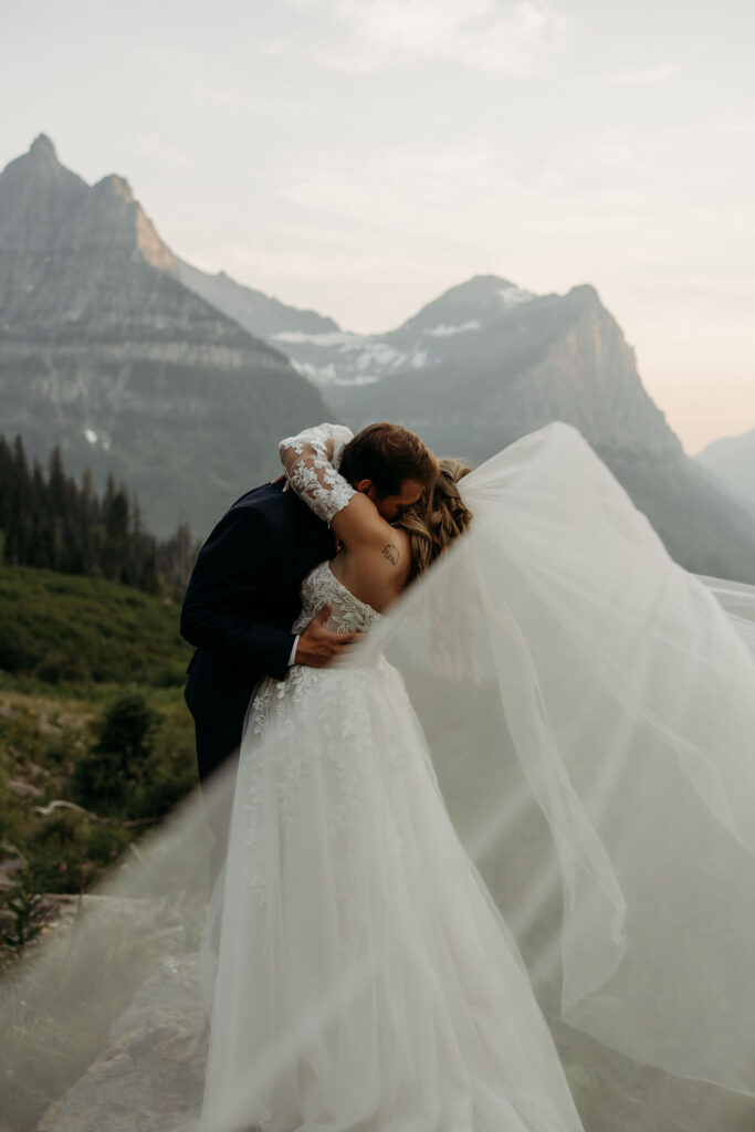 couple having an elopement in gnp at going to the sun road
