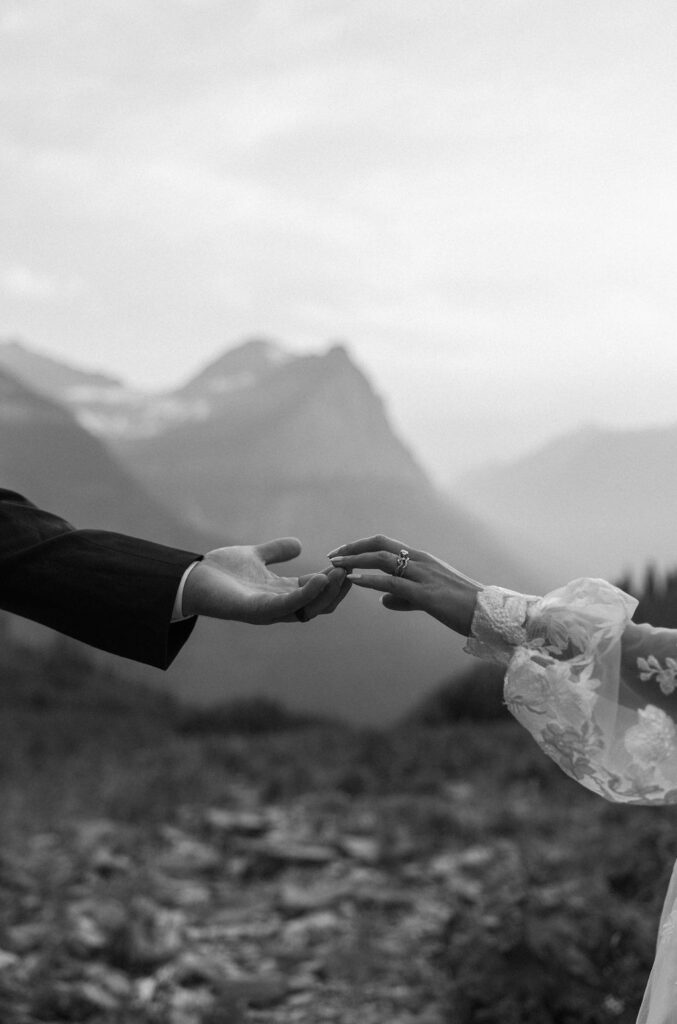 couple having an elopement in gnp at going to the sun road
