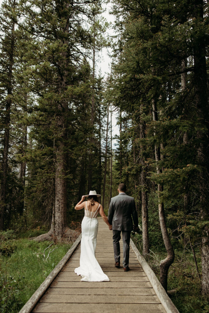 bride and groom taking outdoor elopement photos