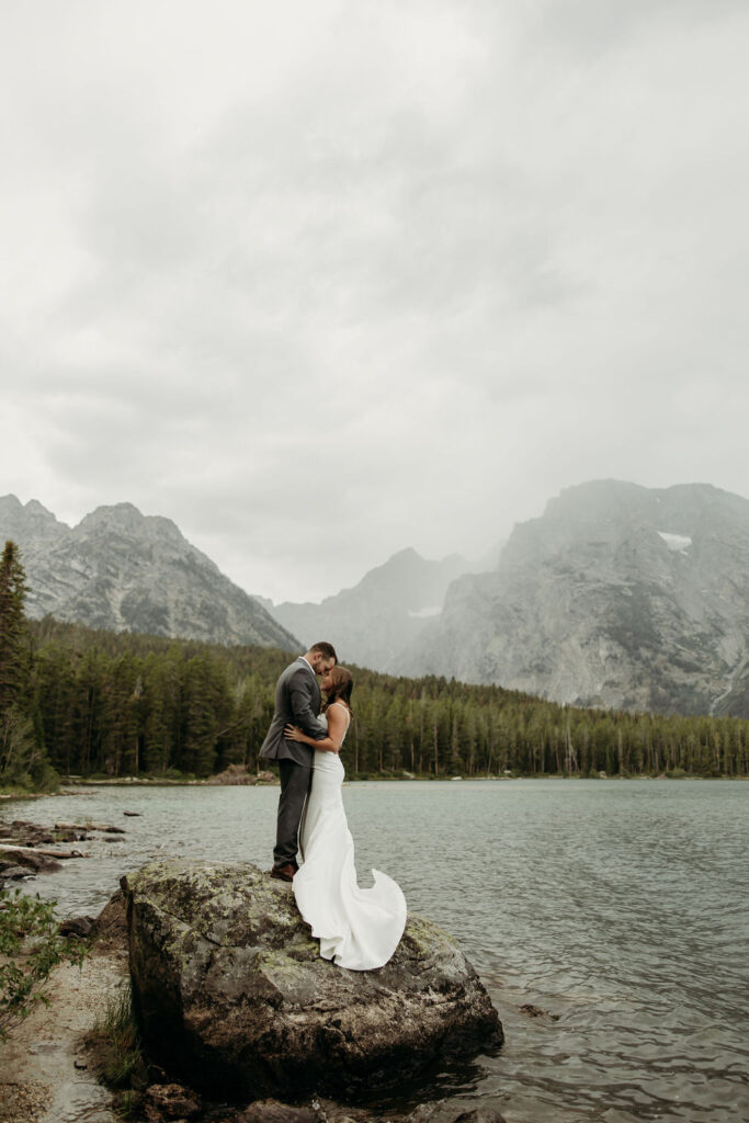 bride and groom taking outdoor elopement photos
