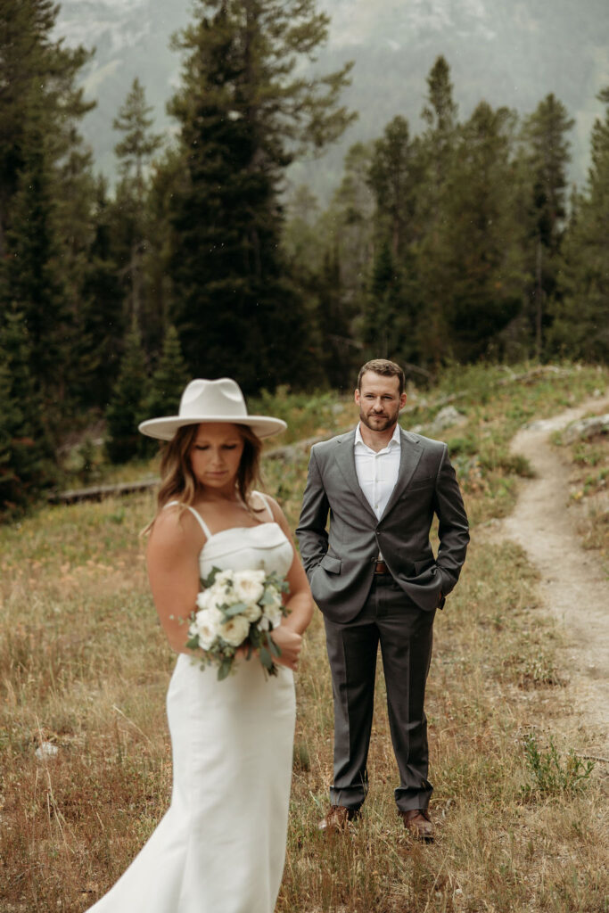 bride and groom taking outdoor elopement photos
