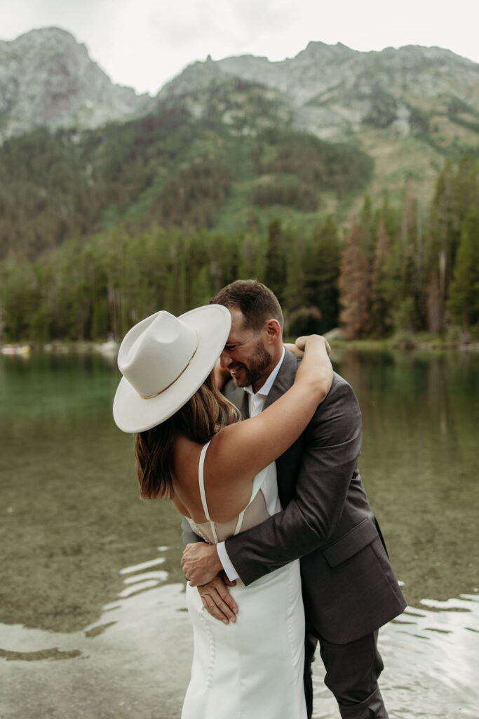 bride and groom taking outdoor elopement photos
