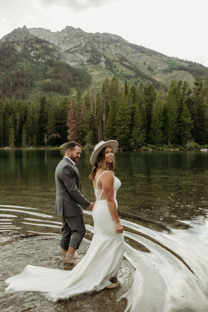 bride and groom taking outdoor elopement photos
