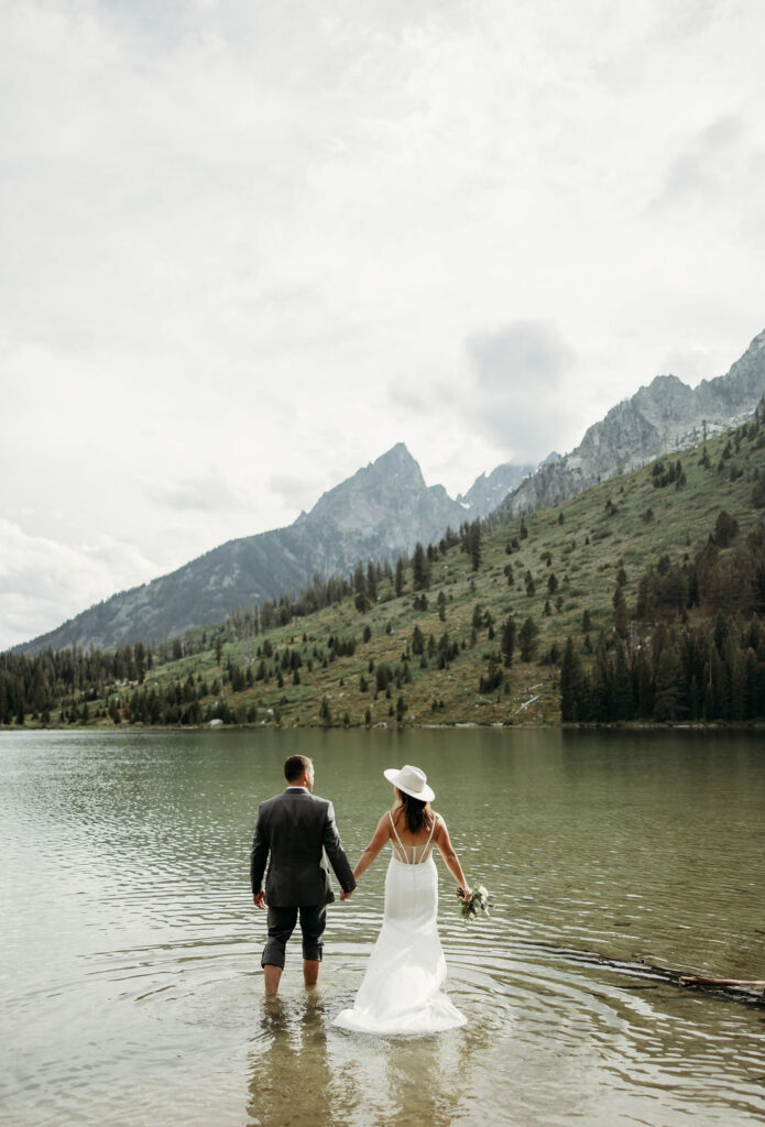 bride and groom taking outdoor elopement photos
