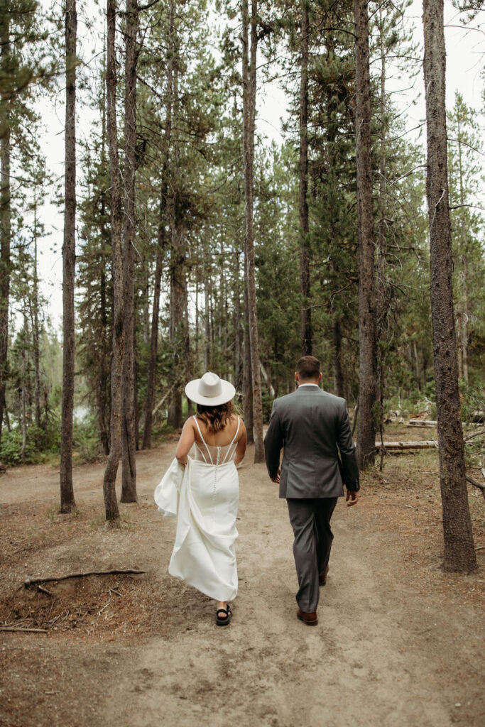 bride and groom taking outdoor elopement photos