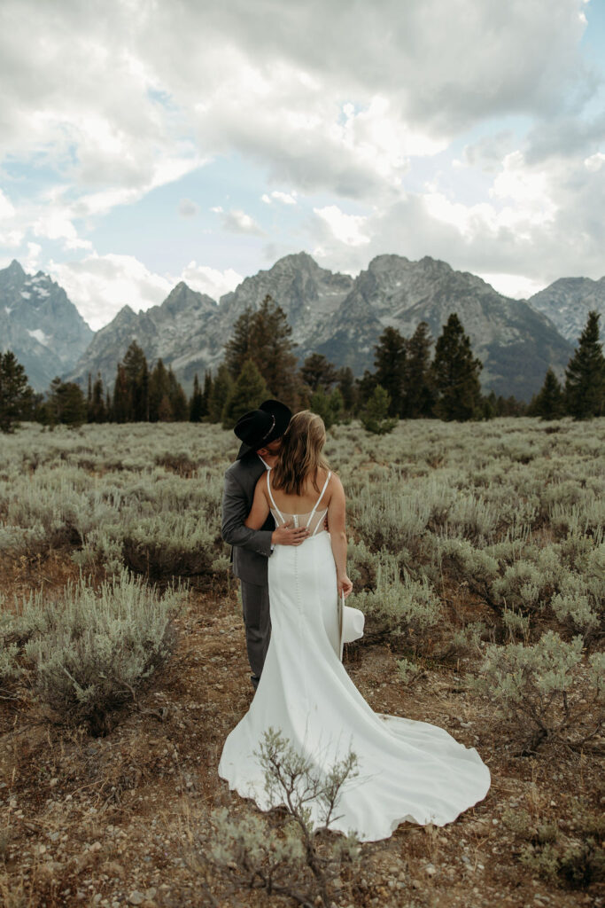 bride and groom taking outdoor elopement photos
