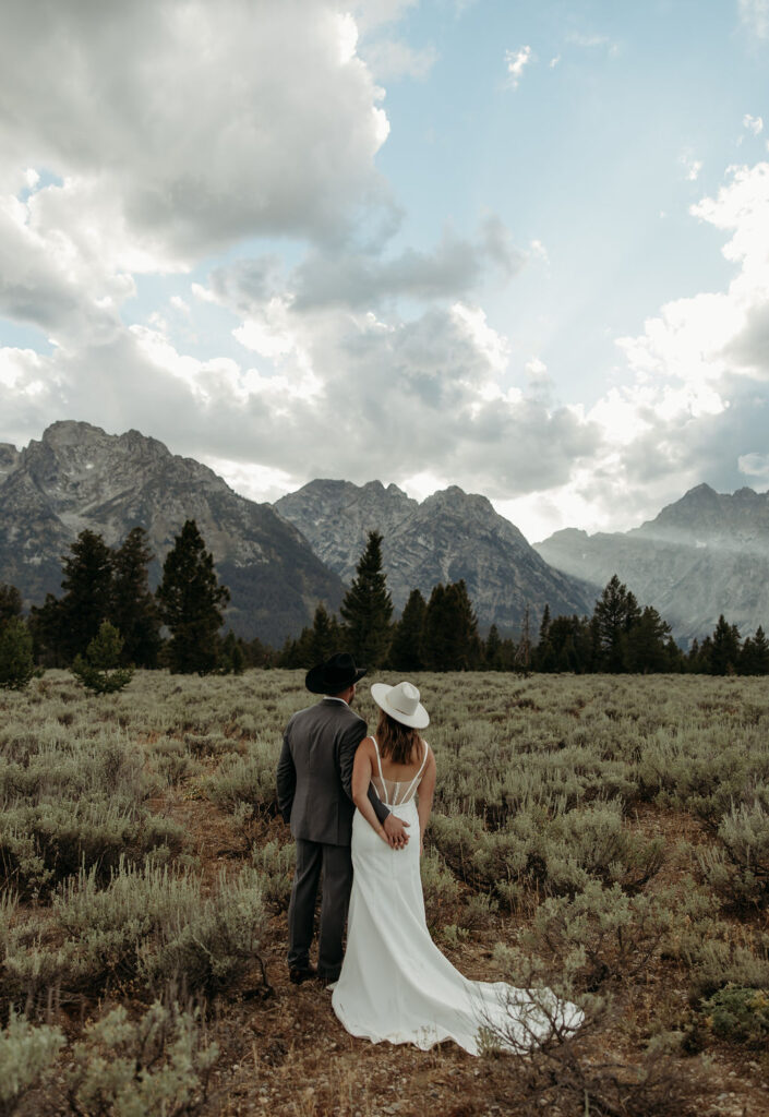 bride and groom taking outdoor elopement photos
