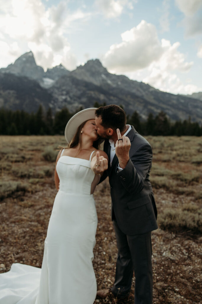 bride and groom taking outdoor elopement photos
