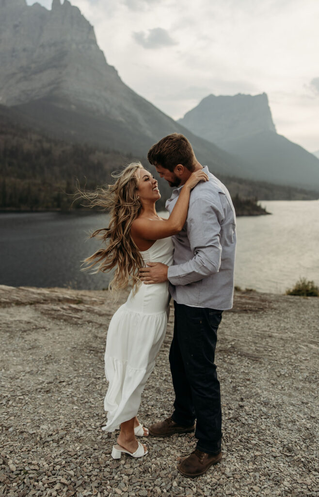 couple posing in glacier national park
