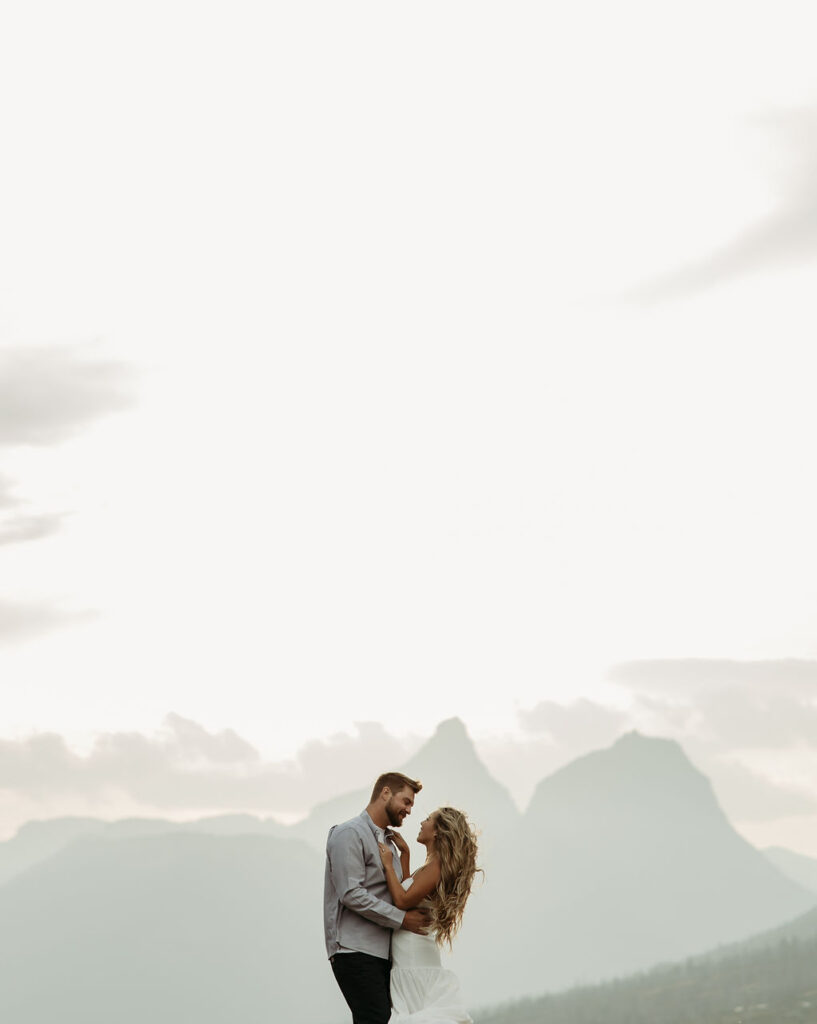 couple posing in glacier national park
