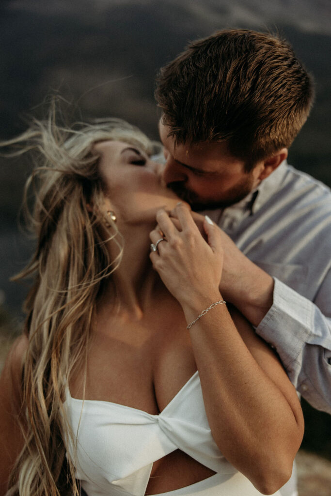 couple posing in glacier national park
