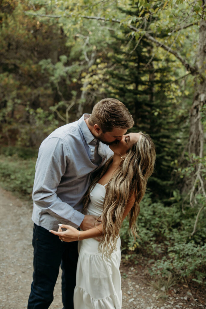 couple posing in glacier national park
