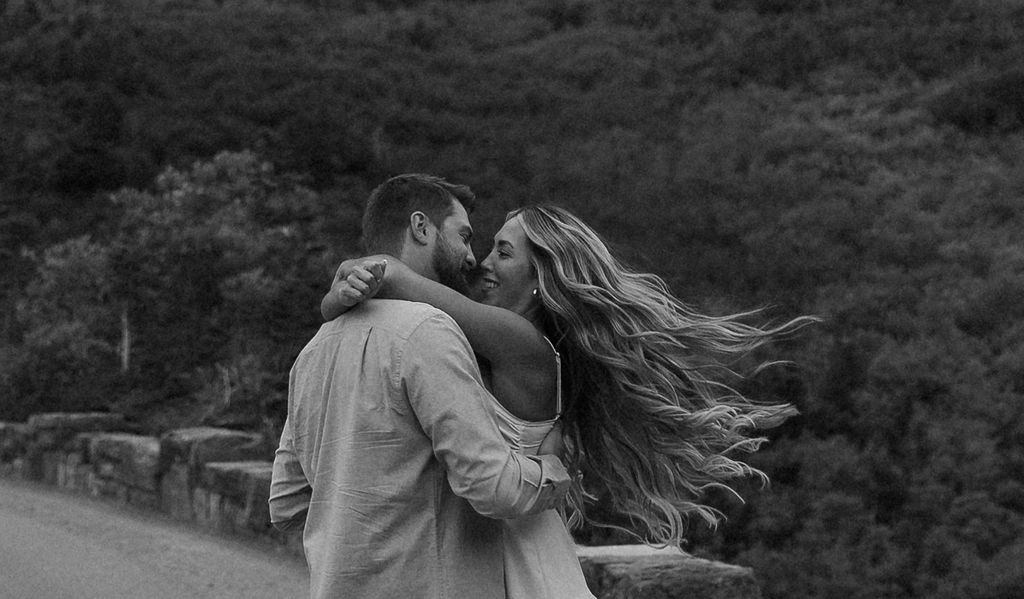 couple posing in glacier national park
