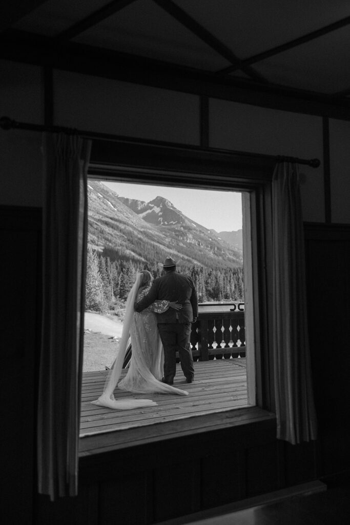 couple posing for their glacier national park elopement
