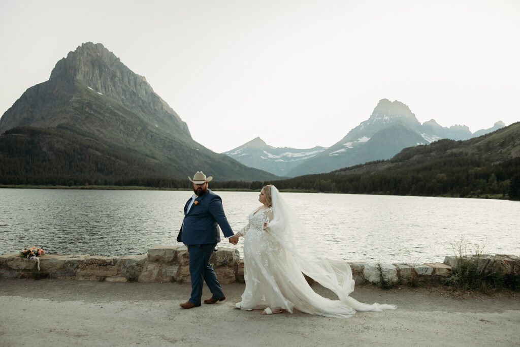 couple posing for their glacier national park elopement
