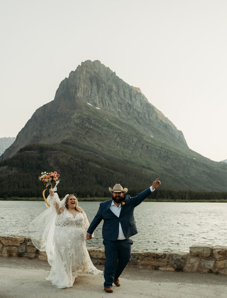 couple posing for their glacier national park elopement