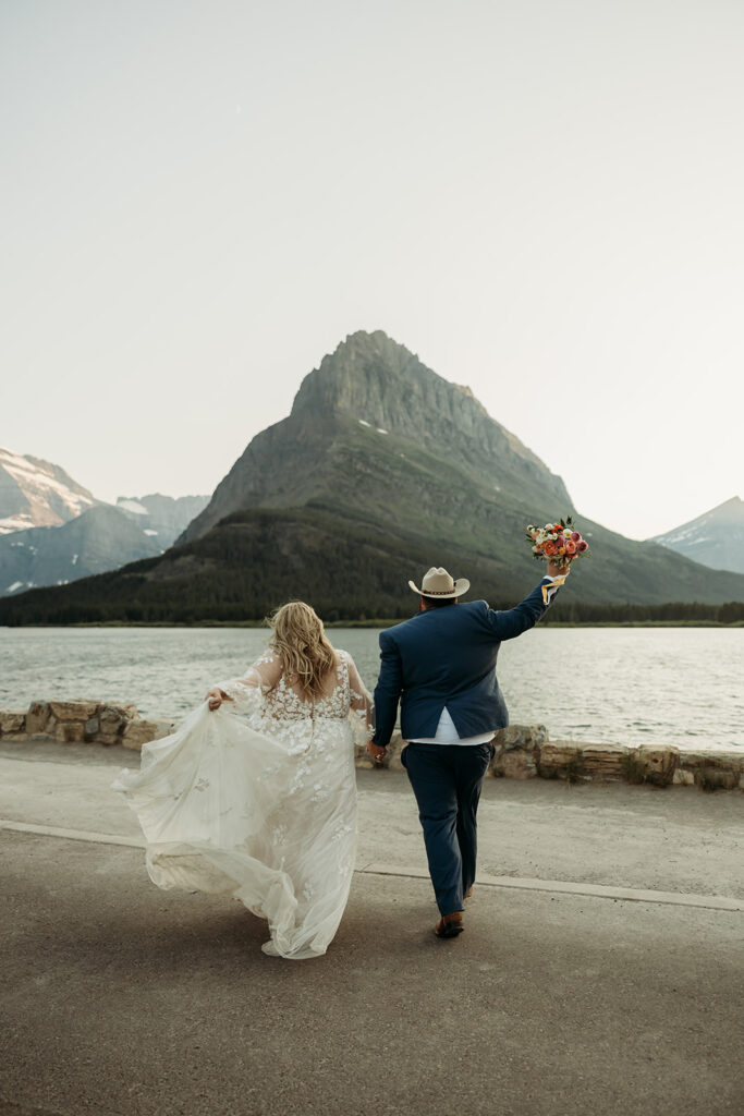 couple posing for their glacier national park elopement
