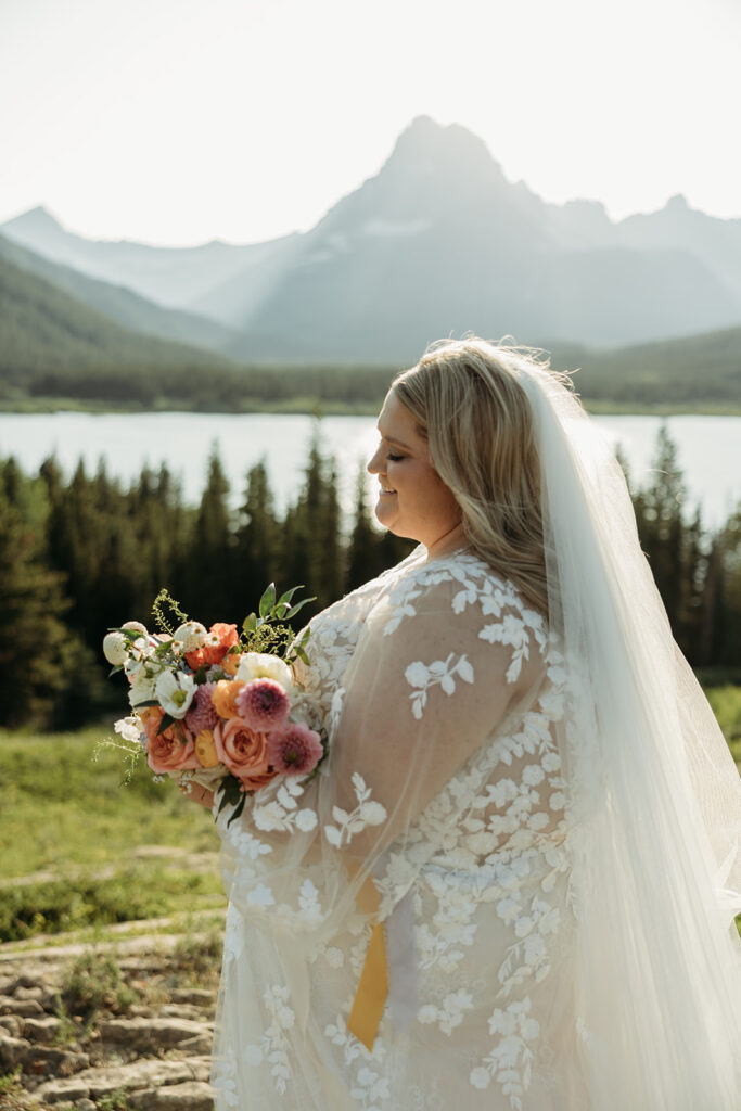 couple posing for their glacier national park elopement
