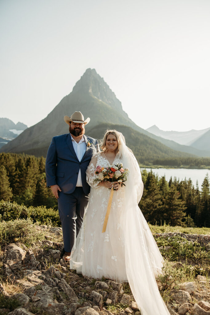 couple posing for their glacier national park elopement
