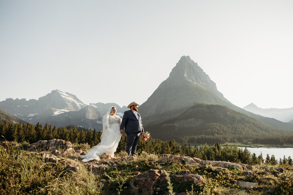 couple posing for their glacier national park elopement
